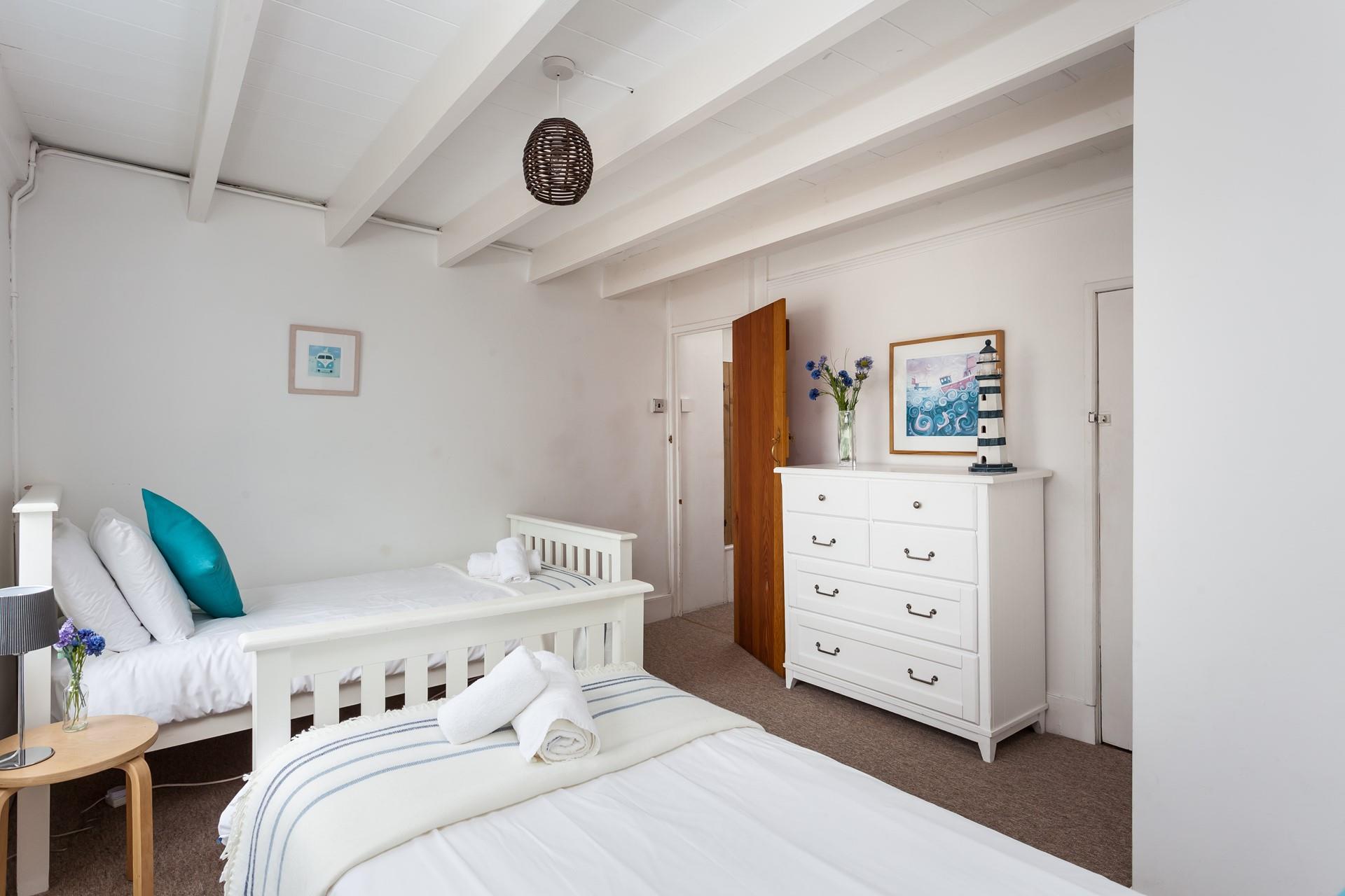 Simply styled, bedroom 4 is calming, and perfect for a restorative night's sleep. 