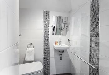Modern and shiny, the ensuite offers luxury and convenience. 