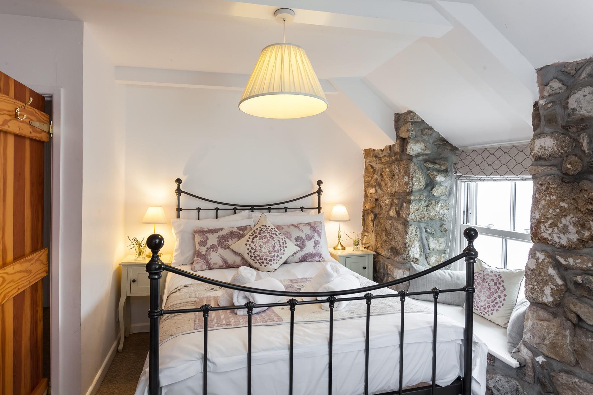 Take a moment to yourself and enjoy sea views from the window seat in bedroom 3. 