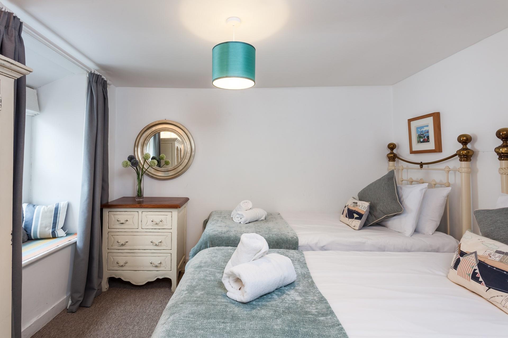 Bedroom 2 offers comfortable twin beds, ideal for either adults or children. 