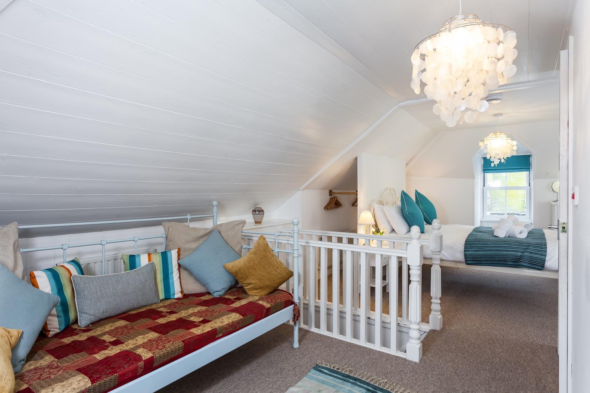 A cute daybed offers a space to sit and read, and is also suitable for a child to sleep on. 