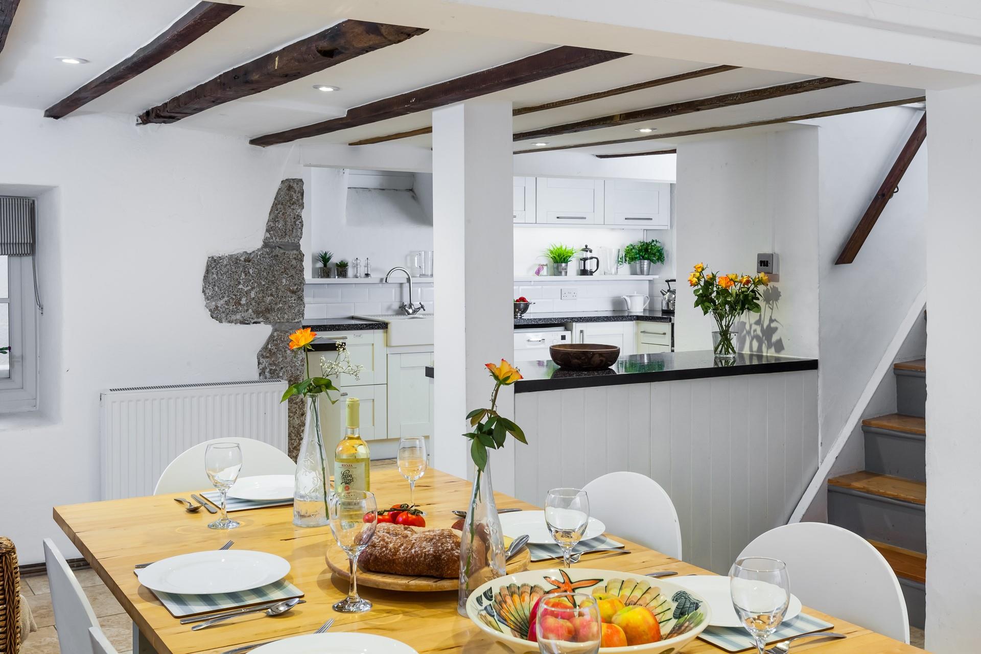 Contemporary meets traditional style in the surprisingly bright kitchen/dining area. 