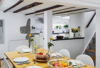Contemporary meets traditional style in the surprisingly bright kitchen/dining area. 