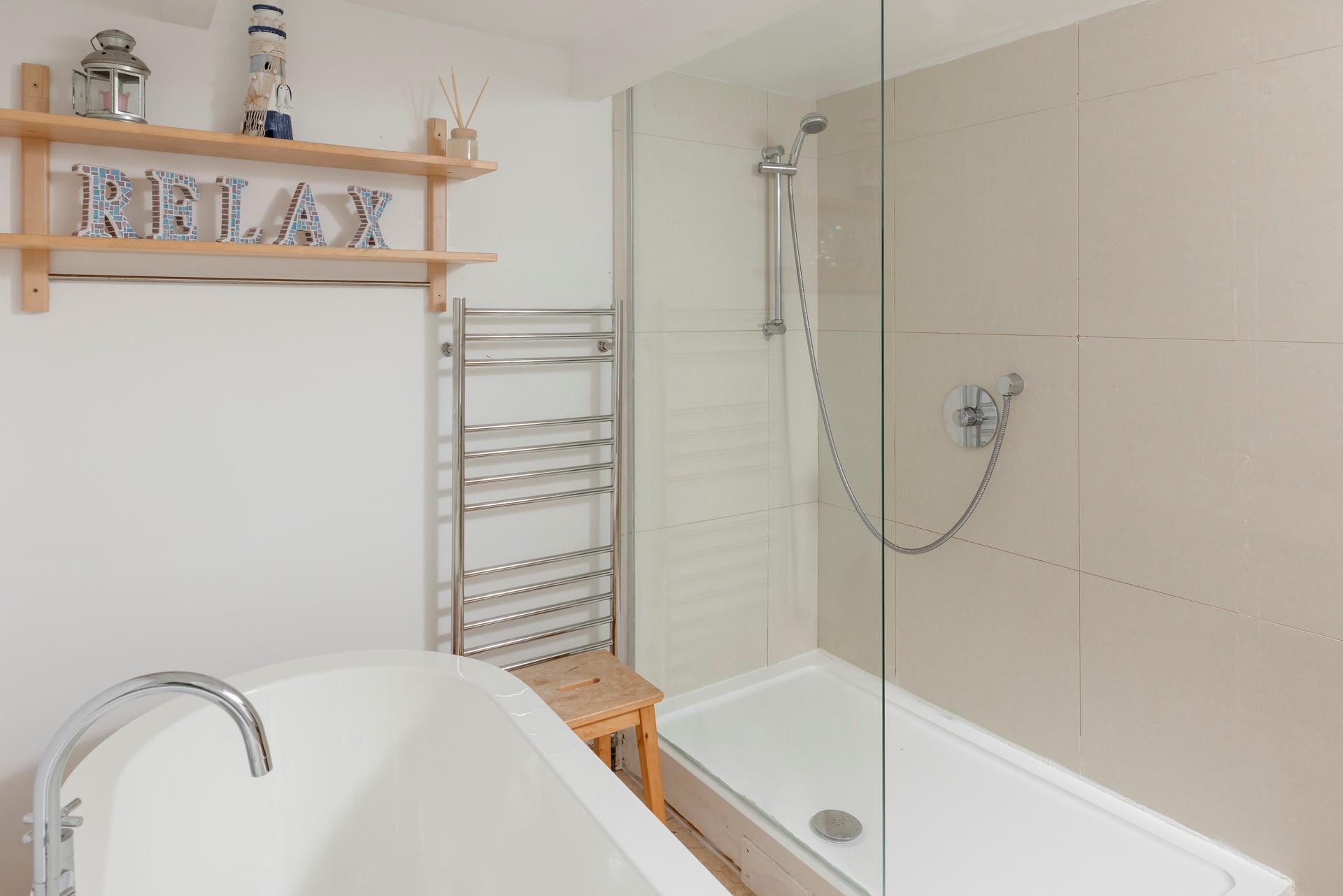 Wash the day away under the large walk-in shower.