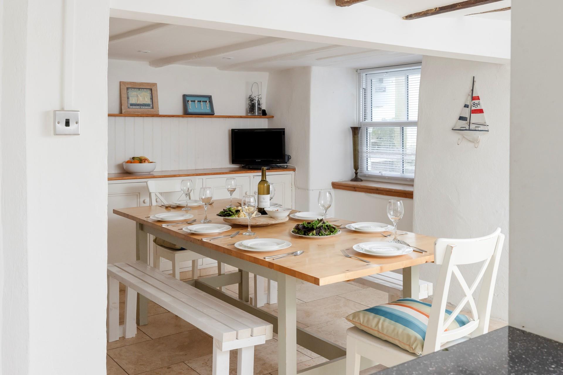 Contemporary meets traditional style in the surprisingly bright kitchen/dining area. 