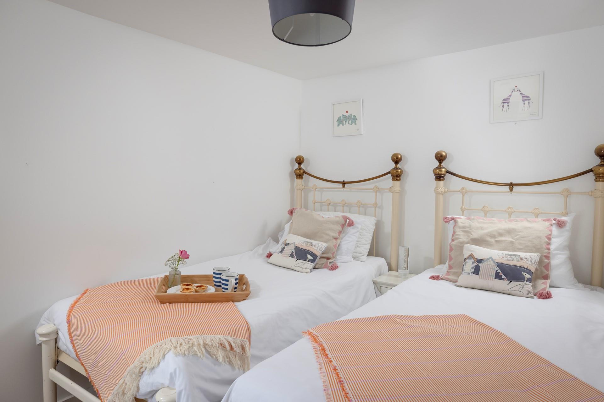 Bedroom 2 offers comfortable twin beds, ideal for either adults or children. 