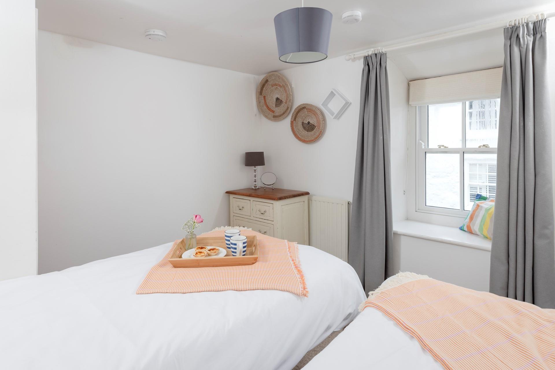 Plump pillows and crisp white linen promise a relaxing night's sleep. 