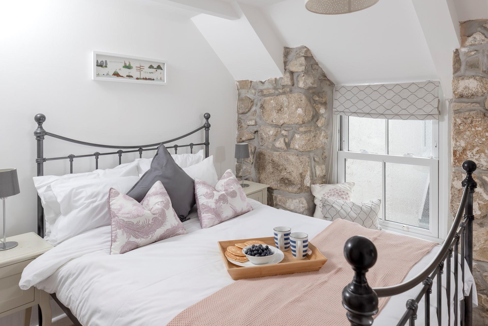 Take a moment for yourself and enjoy sea views from the window seat in bedroom 3. 