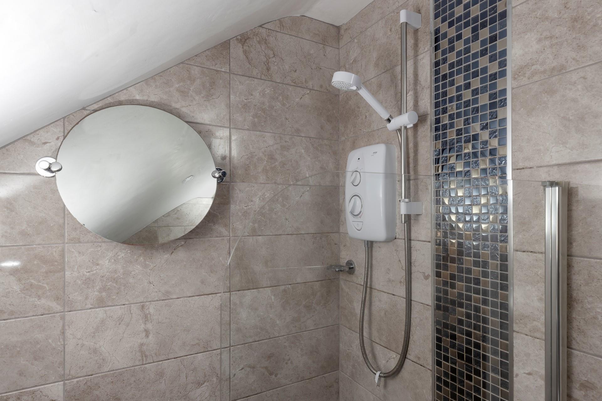 The top floor room benefits from a modern and sleek en suite. 