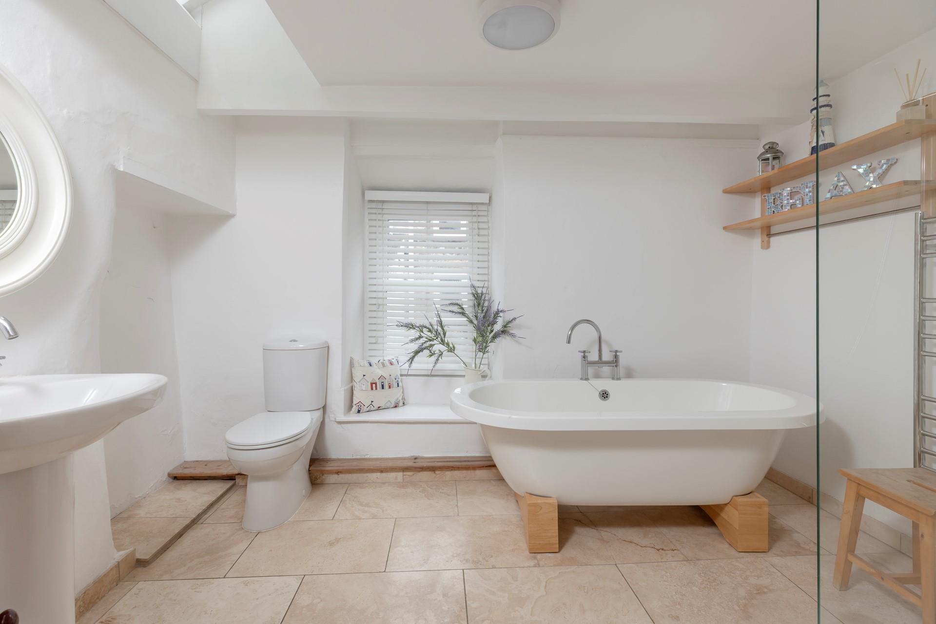 Sink into a sumptuous bath, or wash away any stresses and strains in the large walk-in shower. 