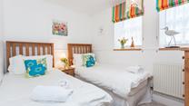 Settle the kids into the twin beds and then open a bottle of wine to sip in your sitting room.