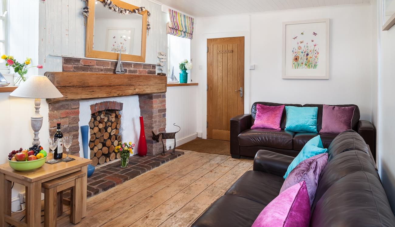 Curl up on the sofa after watching the sun go down on the beach.