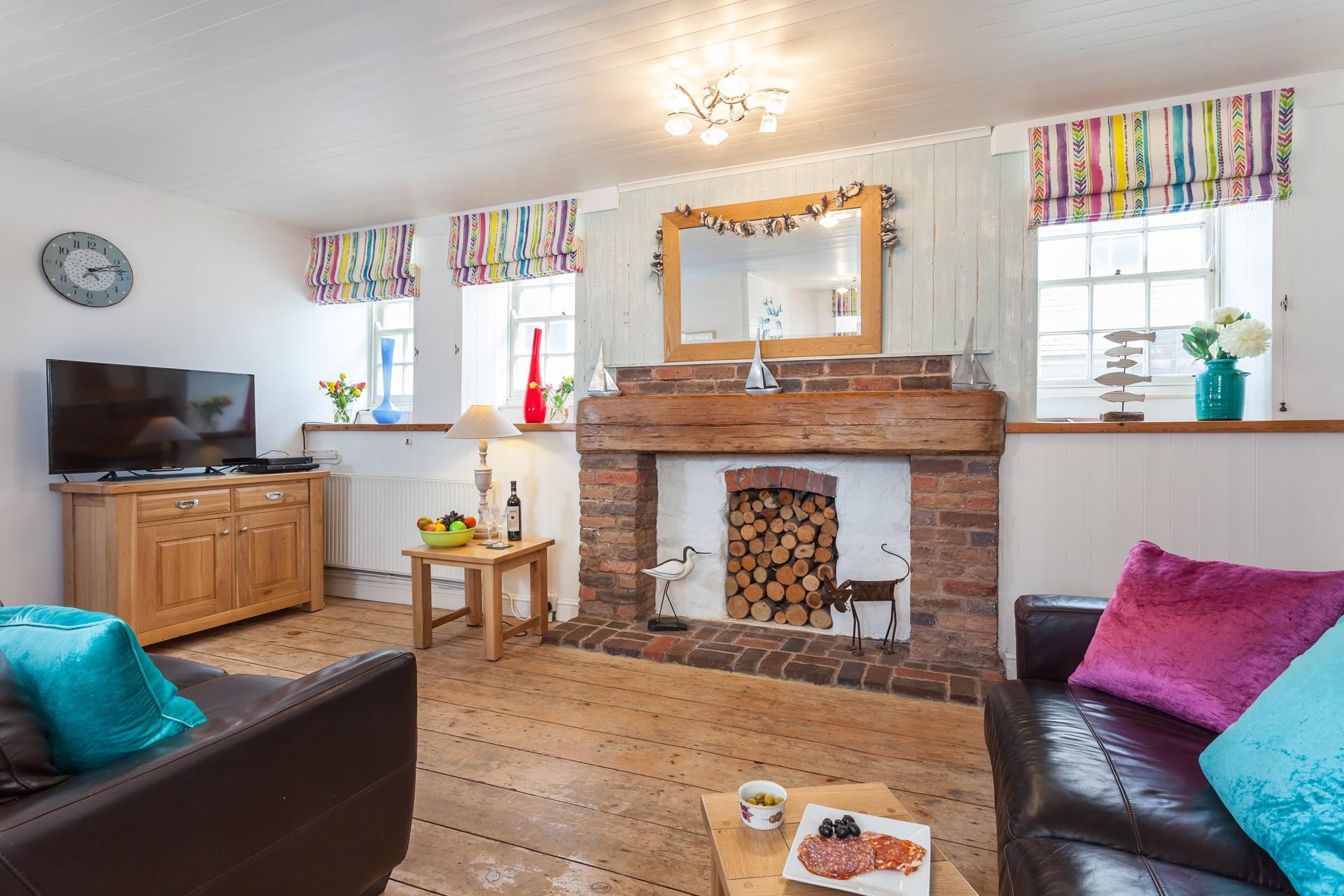 The open plan sitting room/dining area is perfect for the whole family to relax in.