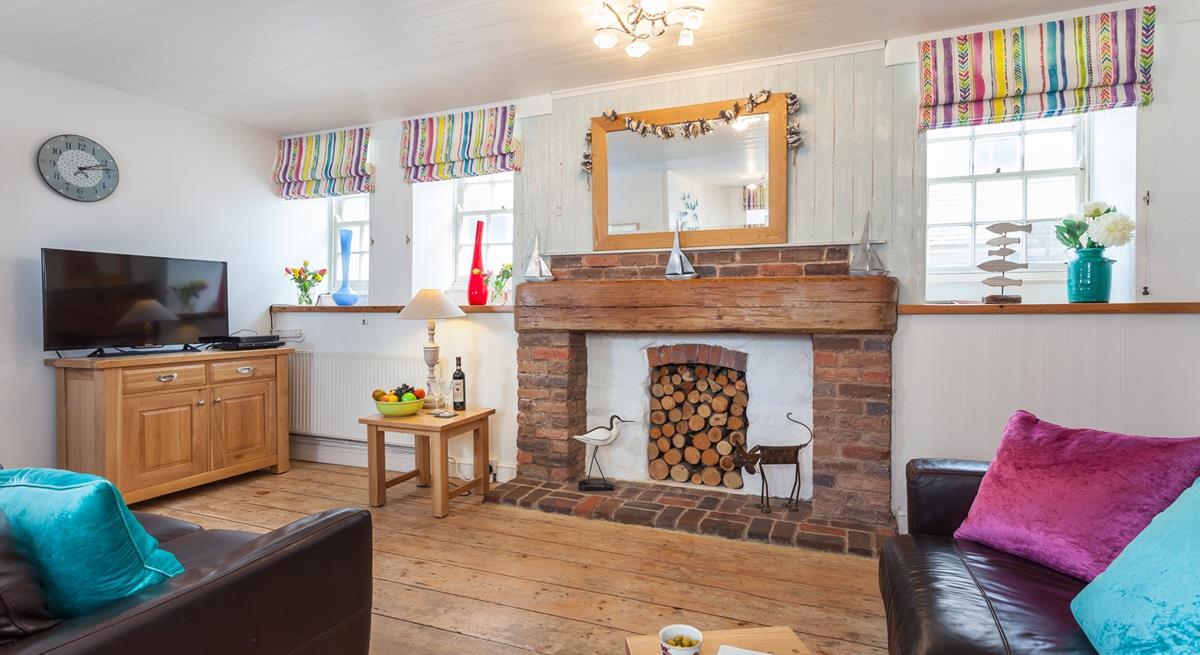 The open plan sitting room/dining area is perfect for the whole family to relax in.