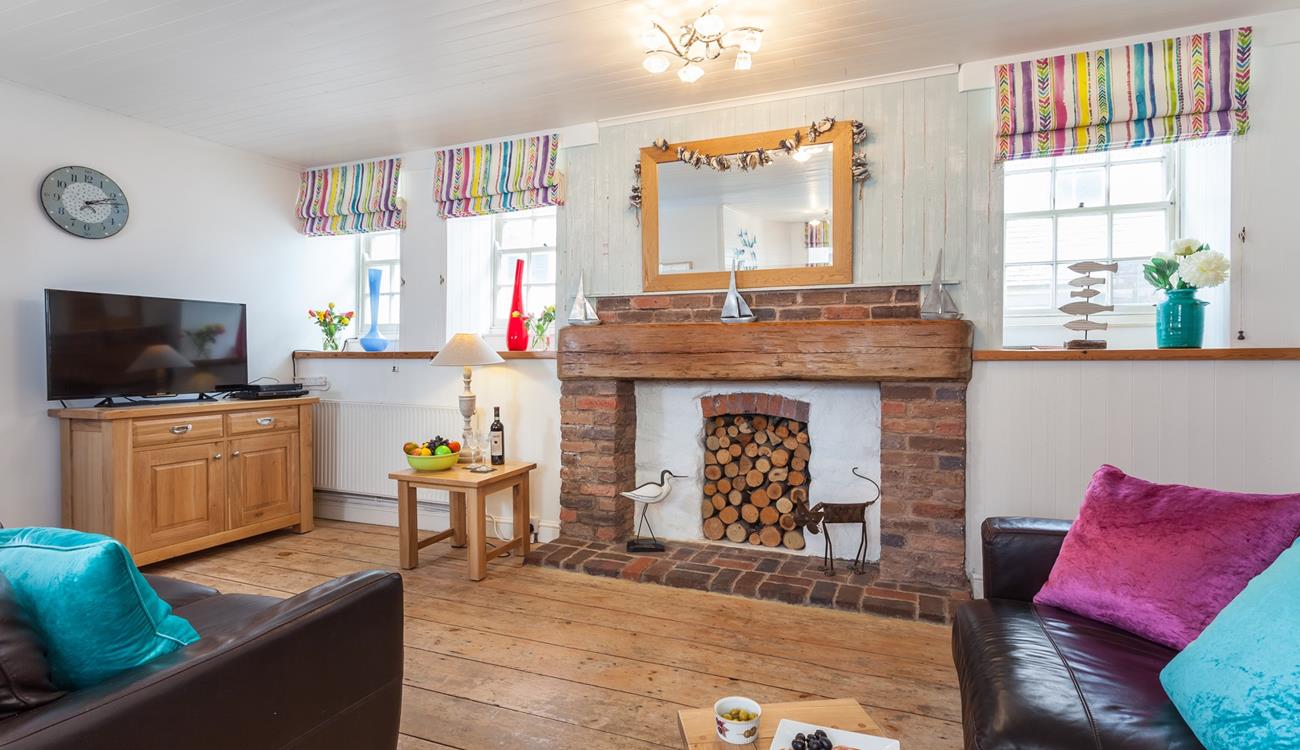 The open plan sitting room/dining area is perfect for the whole family to relax in.