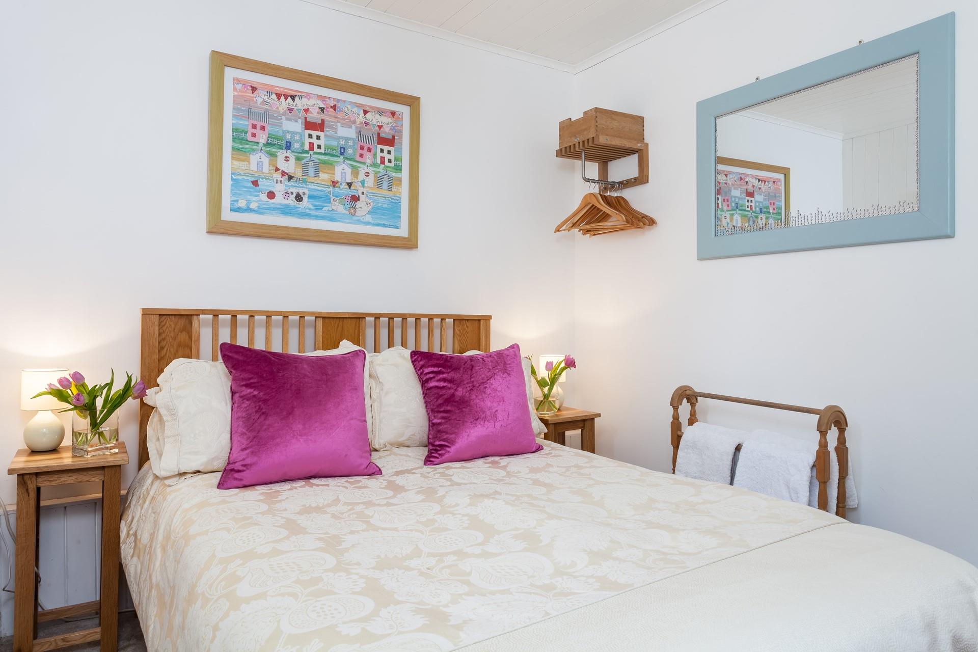 The double bedroom is the perfect space to unwind and enjoy a blissful night's sleep.