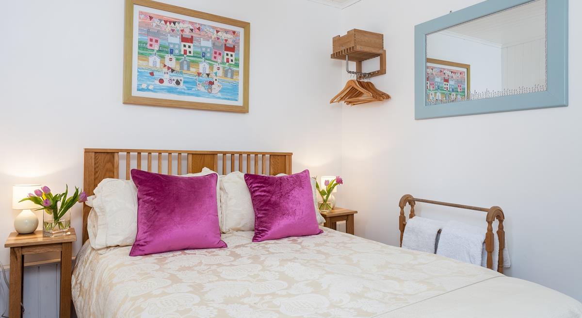 The double bedroom is the perfect space to unwind and enjoy a blissful night's sleep.