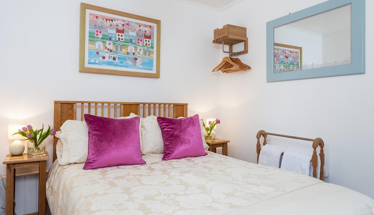 The double bedroom is the perfect space to unwind and enjoy a blissful night's sleep.