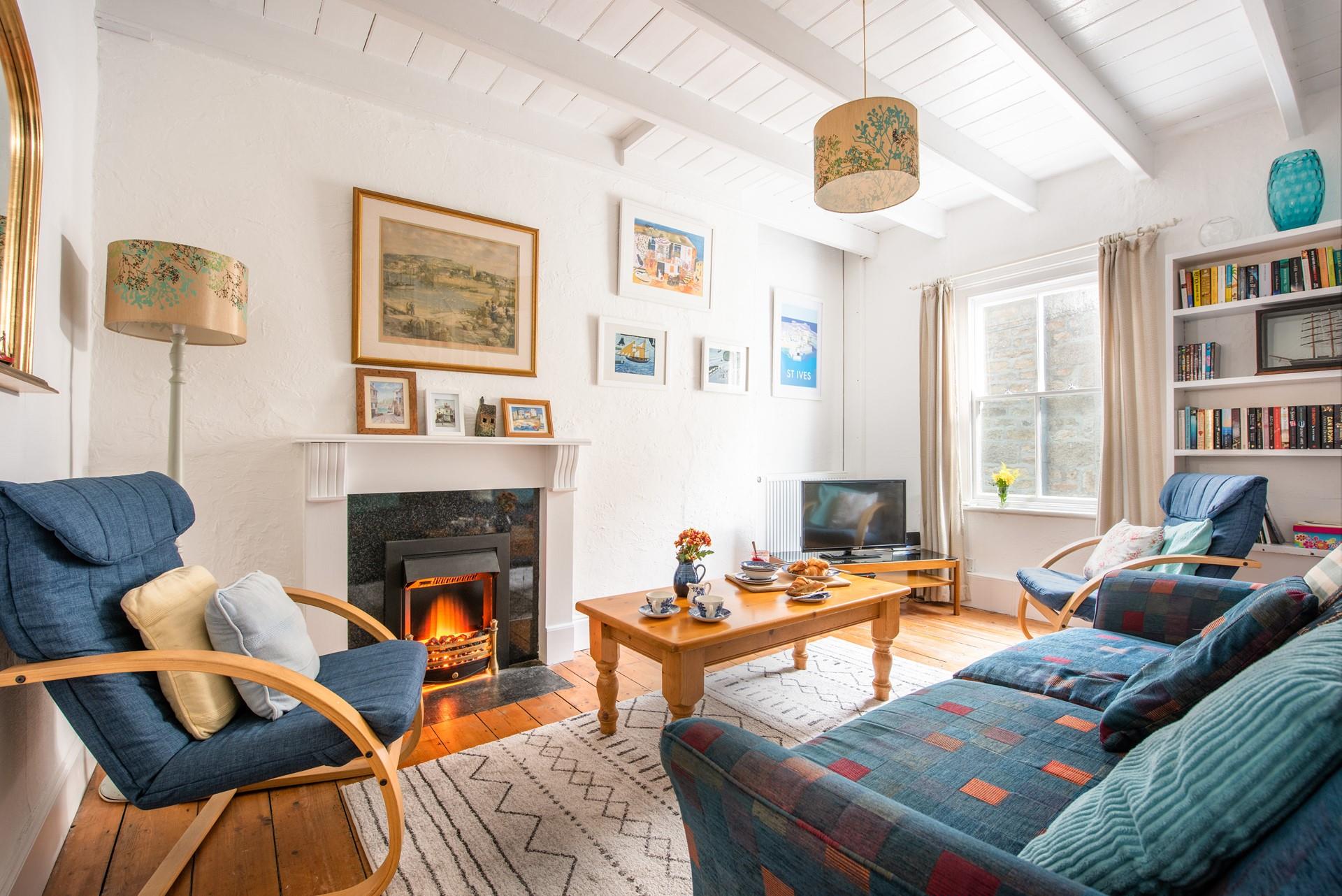 The living area is a stunning, homely space that seamlessly blends a mixture of colours and textures that welcome you in and invite you to relax.