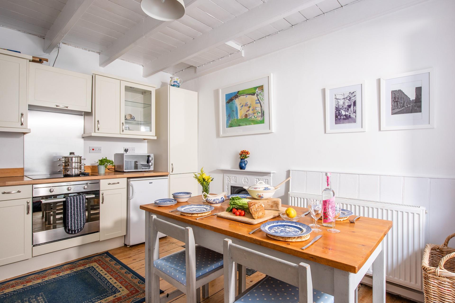 The open plan kitchen and dining area allow you to socialise whilst cooking.