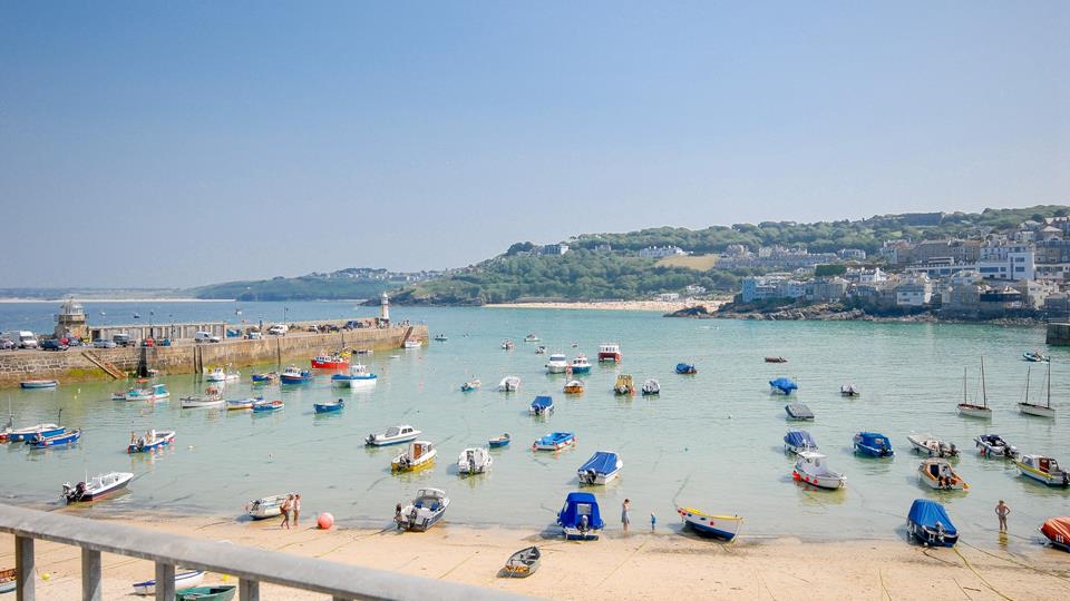 The property is ideally situated on the harbour front, with fantastic views over the Harbour and Cornwall's rugged coastline in the background.