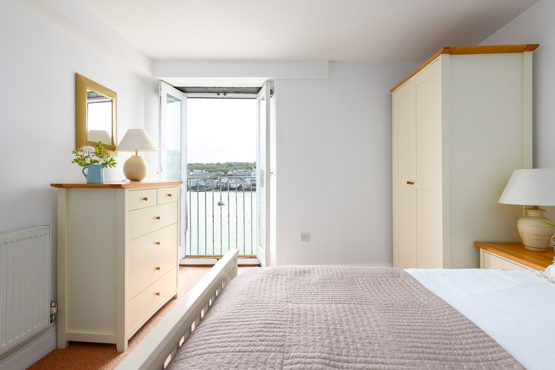 Wake up and wander out to your Juliet balcony to watch the boats bobbing in the harbour.