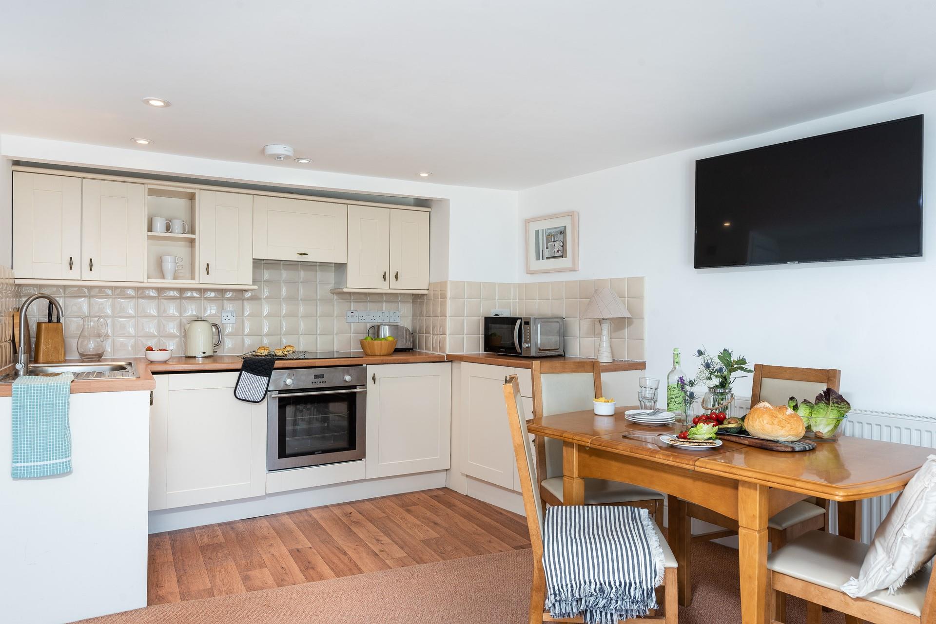 The country-style kitchen offers you everything you need to cook up a storm.