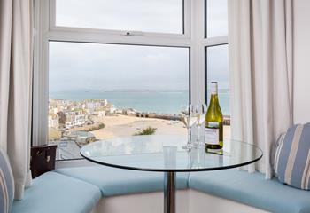 Sit in the window seat and take in the lovely views with a cold glass of wine.