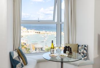 Sit in the window seat and take in the lovely views with a cold glass of wine.