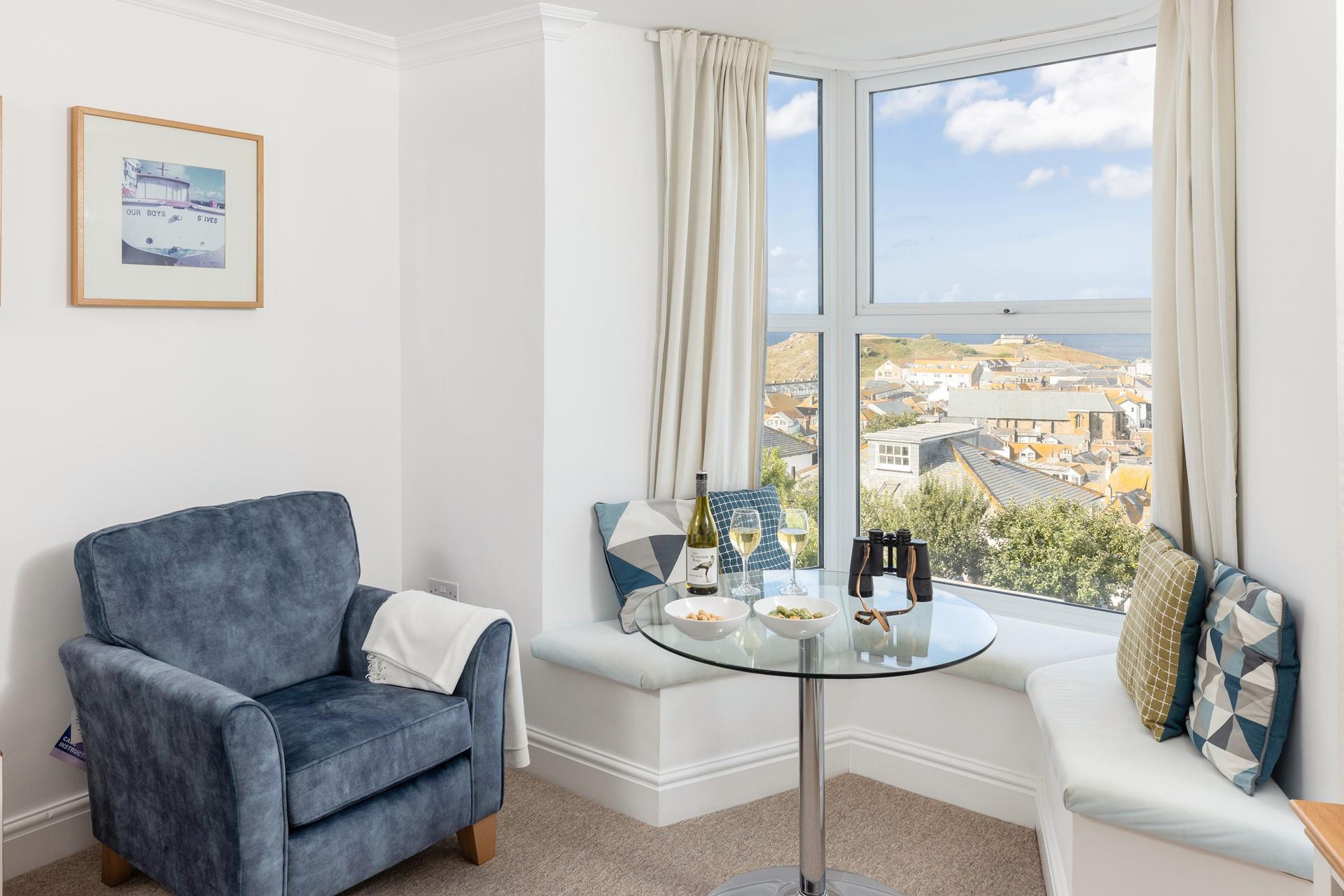 The comfortable sitting room offers breathtaking views across St Ives.