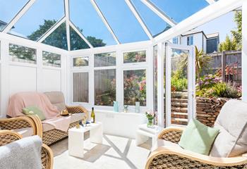 The conservatory is perfect for long lazy afternoons spent unwinding with the summer breeze running through.