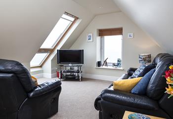 The cosy sitting room is perfect for getting snug and enjoying an evening of films.