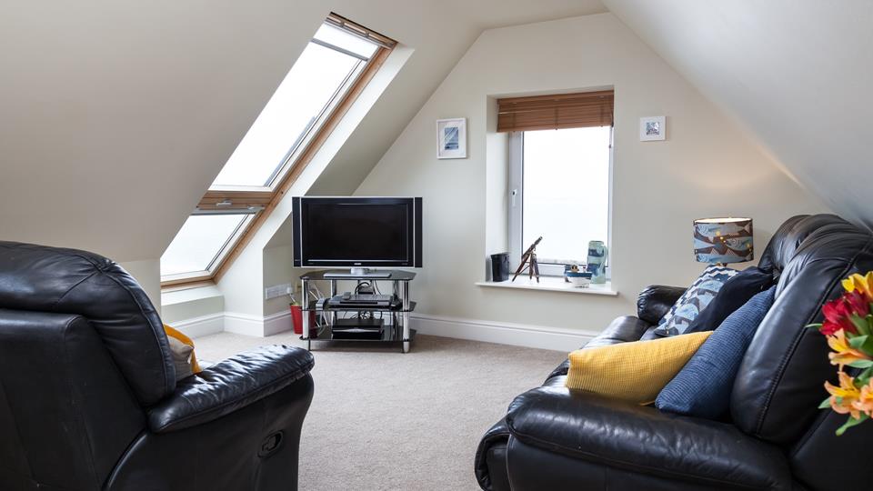 The cosy sitting room is perfect for getting snug and enjoying an evening of films.