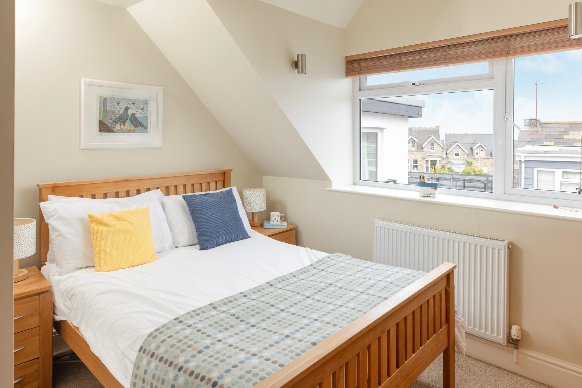 Bedroom 3 is coastal-inspired, full of seaside charm.