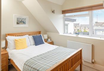 Bedroom 3 is coastal-inspired, full of seaside charm.