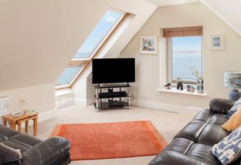 Put your feet up and enjoy the views in the light-filled lounge.