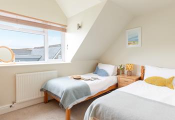 The twin bedroom is bright and brimming with seaside character.
