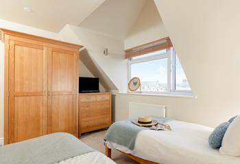 Ideal for kids or adults, the twin bedroom has plenty of storage.