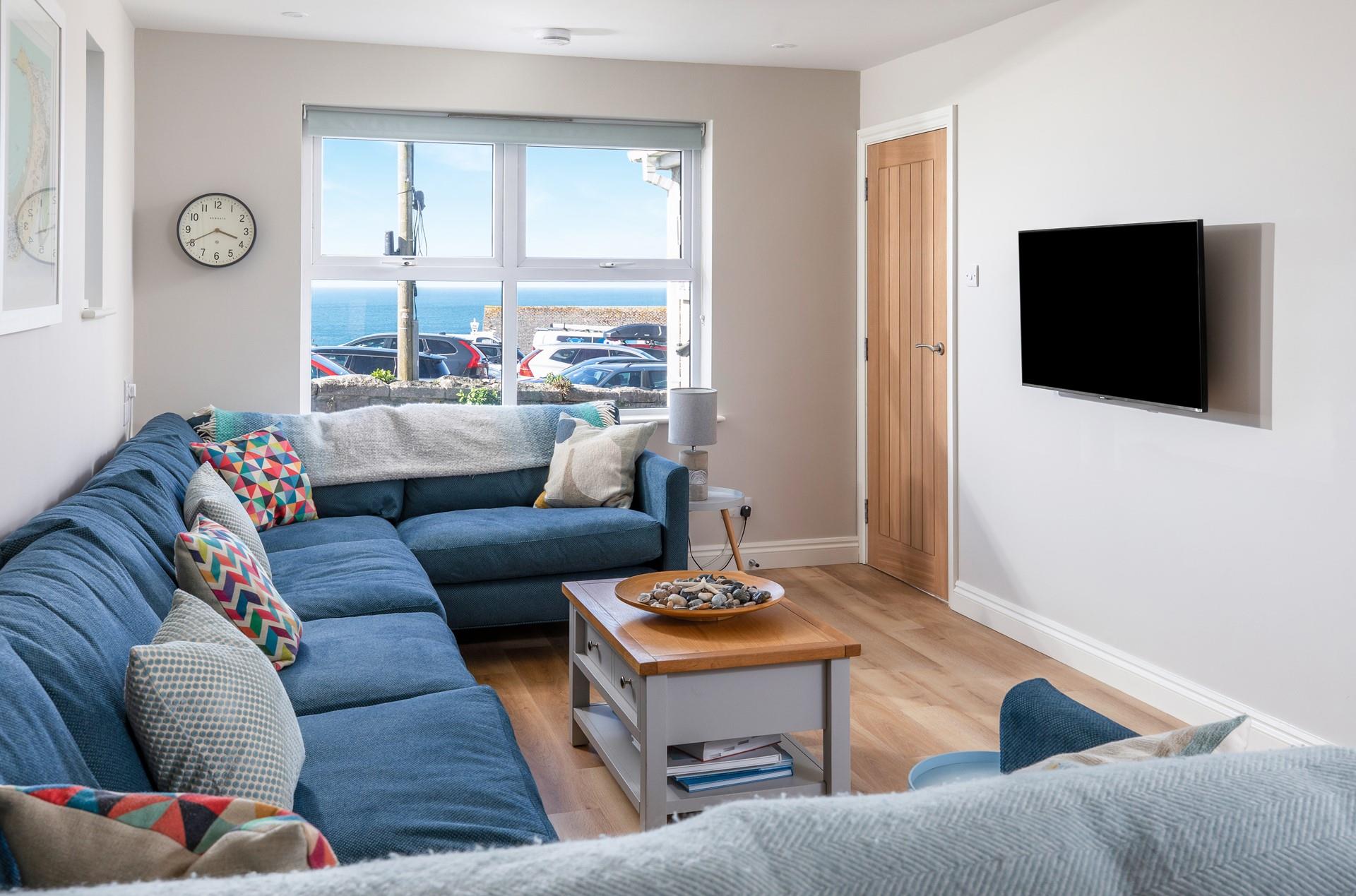 After a busy day on the beach, unwind together in the cosy lounge area.