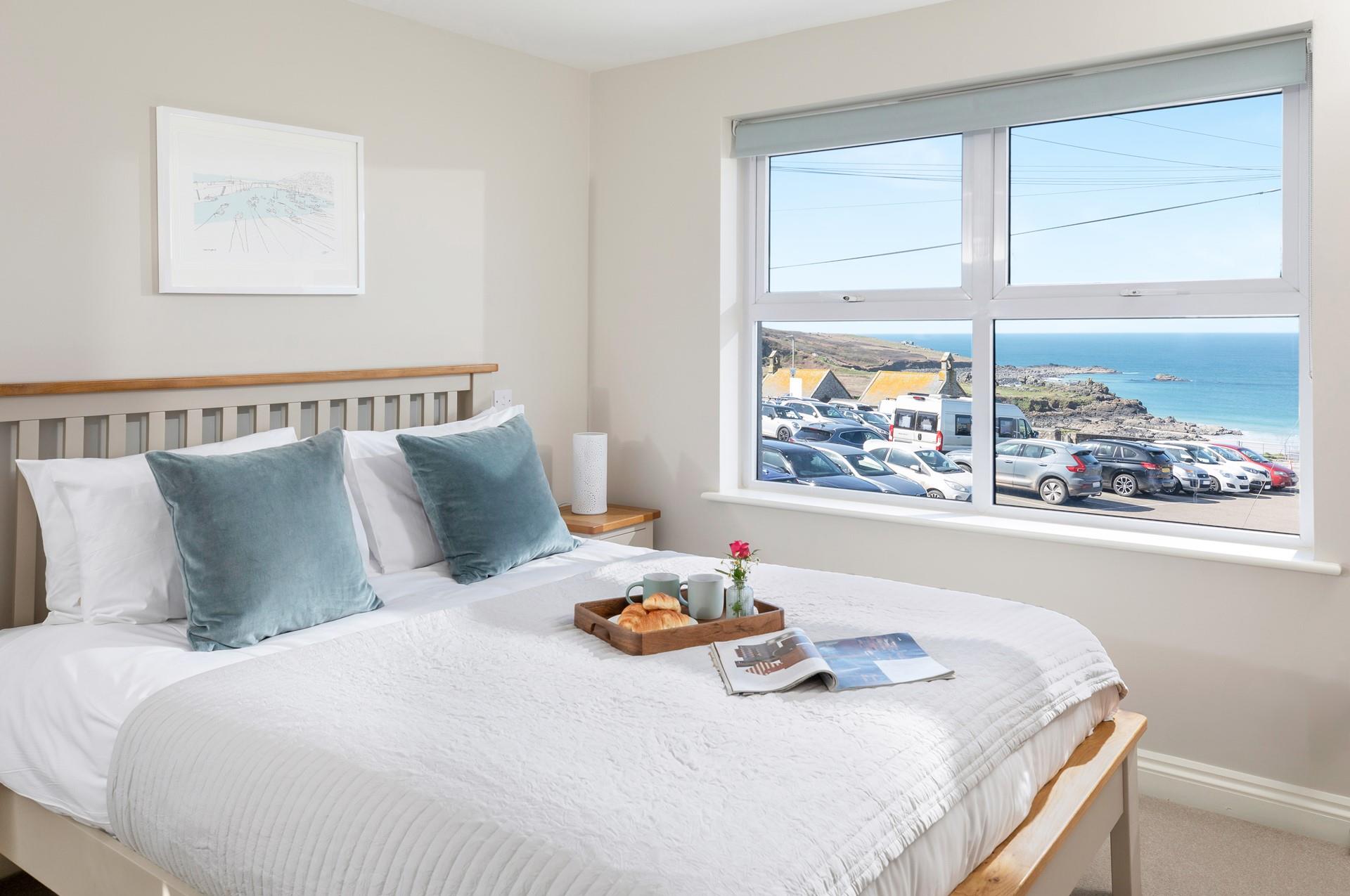 Bedroom 2 has a king size bed and lovely sea views to wake up to.