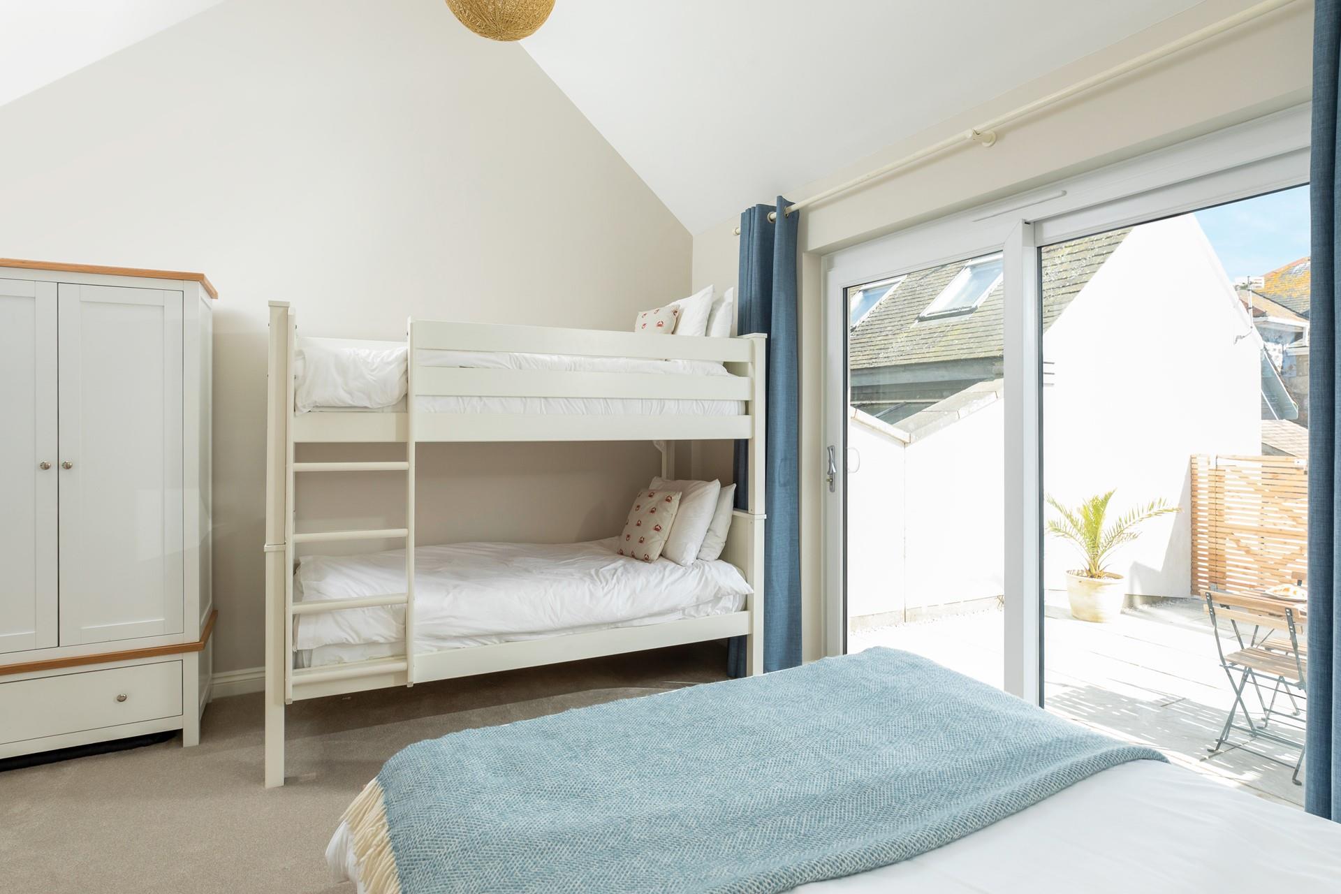 Step from bedroom 1 onto the spacious patio.