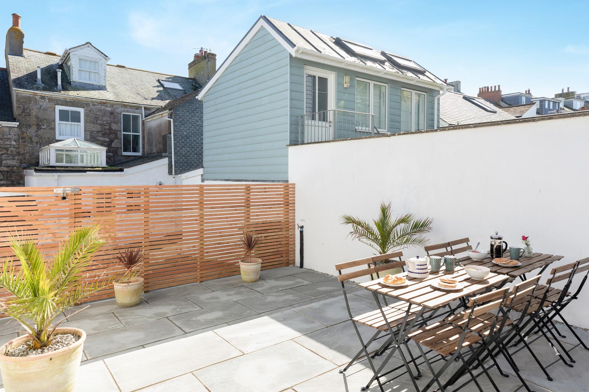 The patio is a lovely enclosed spot for dining al fresco!