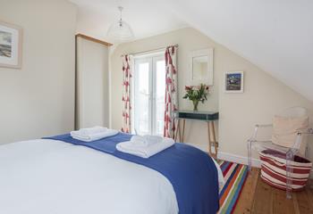 Bedroom 4 has a sumptuous king size bed for restful nights.