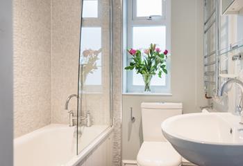 The family bathroom is beautifully decorated, perfect for pampering yourself after a busy day.
