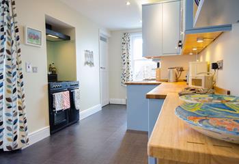 Foodies in the family will enjoy cooking up a feast in the bright kitchen.