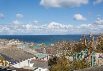 Look out over the quaint St Ives rooftops to the beauty of the sea glistening in the distance.