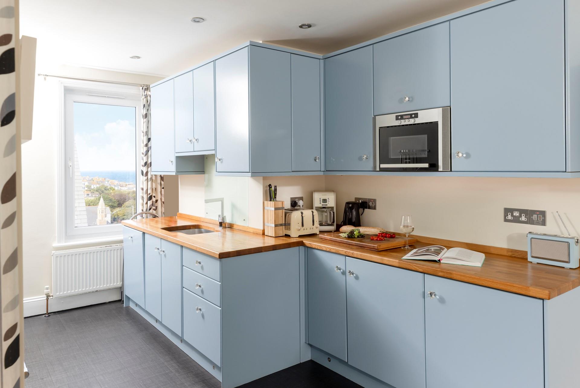 Foodies in the family will enjoy cooking up a feast in the bright kitchen.