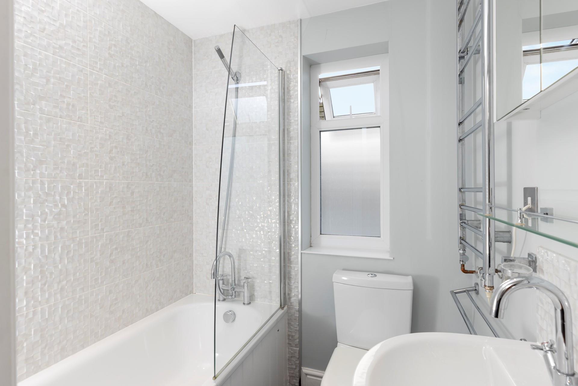 The family bathroom gives you the choice of a shower or bath after a day on the beach.