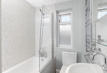 The family bathroom gives you the choice of a shower or bath after a day on the beach.