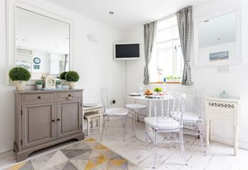 This bijou apartment is elegantly decorated with dove themed finishing touches. 